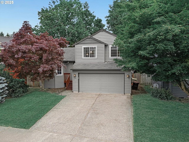 1573 SE 67th Ave, Hillsboro, OR 97123 - view of front of house featuring a shingled roof, concrete driveway, and a garage
