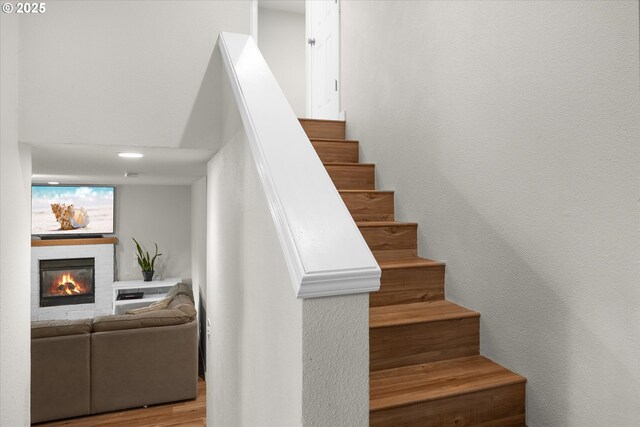 1573 SE 67th Ave, Hillsboro, OR 97123 - staircase with a fireplace and wood finished floors