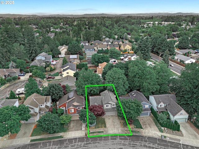 1573 SE 67th Ave, Hillsboro, OR 97123 - aerial perspective of suburban area with a forest and property parcel outlined