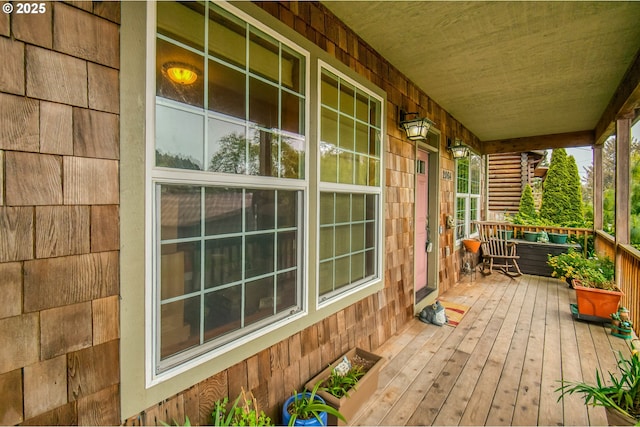 2064 NW 33rd St, Lincoln City, OR 97367 - living area featuring baseboards, stairway, and dark stone finish floors