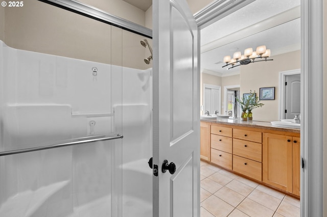 6420 SE Dunbar Dr, Portland, OR 97236 - full bath featuring double vanity, tile patterned floors, a shower with shower door, and ornamental molding