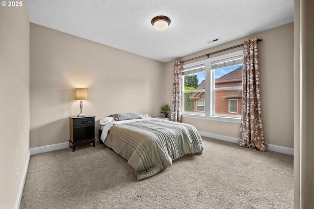 6420 SE Dunbar Dr, Portland, OR 97236 - carpeted bedroom featuring baseboards and a textured ceiling