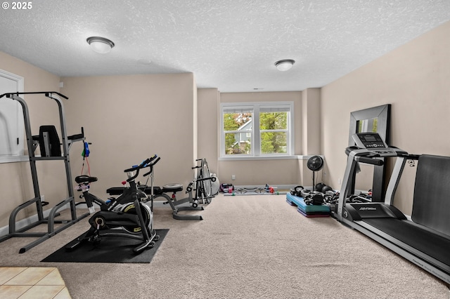 6420 SE Dunbar Dr, Portland, OR 97236 - workout room featuring a textured ceiling and baseboards