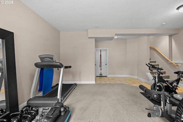 6420 SE Dunbar Dr, Portland, OR 97236 - workout room with tile patterned floors and a textured ceiling