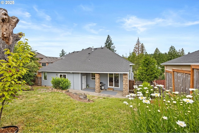 6420 SE Dunbar Dr, Portland, OR 97236 - rear view of house featuring a patio, a shingled roof, and stone siding
