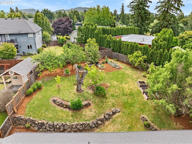 6420 SE Dunbar Dr, Portland, OR 97236 - fenced backyard featuring a vegetable garden