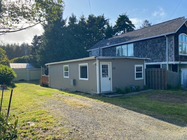 681 SE Neptune Ave, Lincoln City, OR 97367 - rear view of property with driveway