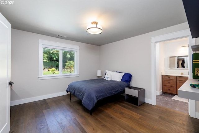 1051 Forest Meadows Way, Lake Oswego, OR 97034 - bedroom with dark wood-style flooring, baseboards, and ensuite bath