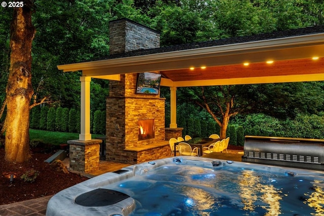 1051 Forest Meadows Way, Lake Oswego, OR 97034 - view of patio / terrace featuring an outdoor stone fireplace, an outdoor hot tub, a gazebo, and a forest view