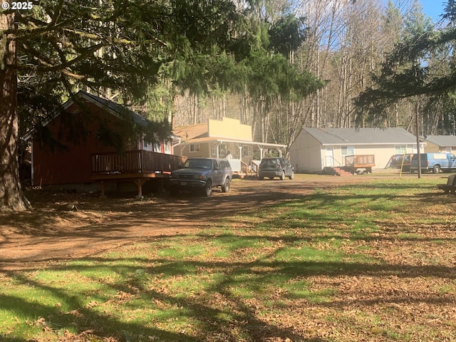 view of yard with a wooden deck