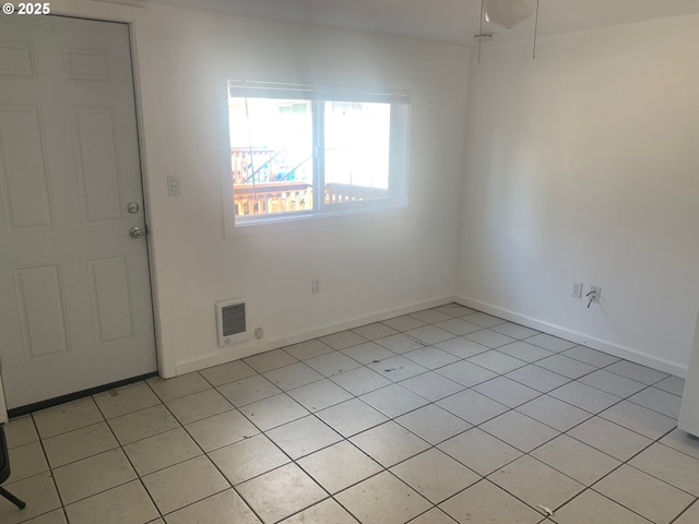 interior space featuring baseboards and visible vents