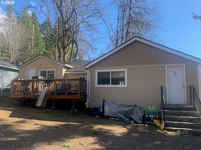 rear view of property with a deck