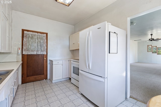 2170 Hubbard Creek Rd, Umpqua, OR 97486 - kitchen with white appliances, light floors, light countertops, and a ceiling fan