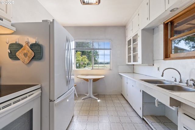 2170 Hubbard Creek Rd, Umpqua, OR 97486 - kitchen with a sink, light floors, white cabinets, electric stove, and light countertops