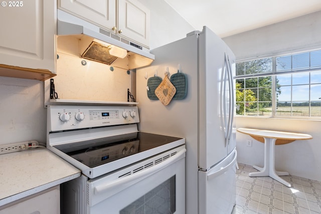 2170 Hubbard Creek Rd, Umpqua, OR 97486 - kitchen featuring white electric stove, under cabinet range hood, white cabinetry, and light countertops