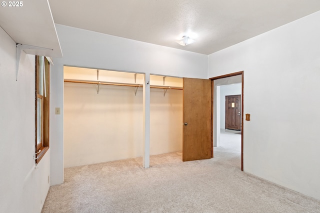 2170 Hubbard Creek Rd, Umpqua, OR 97486 - unfurnished bedroom featuring multiple closets and light carpet