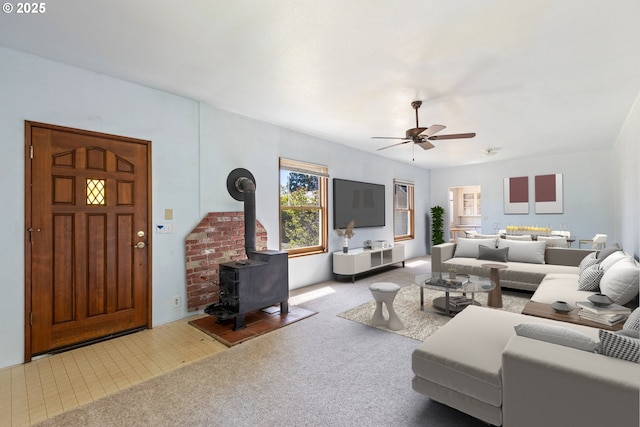 2170 Hubbard Creek Rd, Umpqua, OR 97486 - carpeted living area with ceiling fan and a wood stove