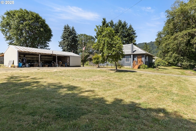 2170 Hubbard Creek Rd, Umpqua, OR 97486 - view of grassy yard with a pole building and an outbuilding