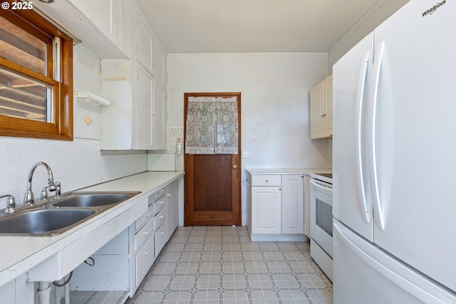 2170 Hubbard Creek Rd, Umpqua, OR 97486 - kitchen with white appliances, a sink, light floors, and light countertops