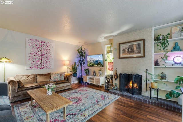 5770 SW Cranberry Ct, Beaverton, OR 97007 - living room featuring wood finished floors, a fireplace, and a textured ceiling