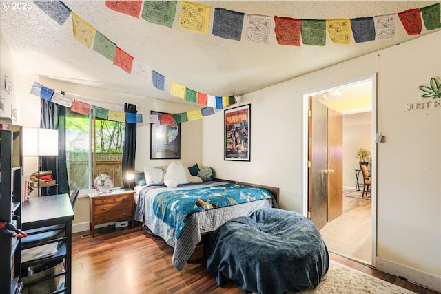 5770 SW Cranberry Ct, Beaverton, OR 97007 - bedroom featuring wood finished floors and baseboards