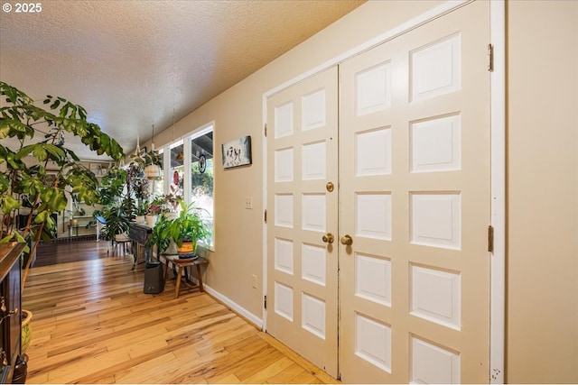 5770 SW Cranberry Ct, Beaverton, OR 97007 - foyer entrance with light wood-type flooring and a textured ceiling