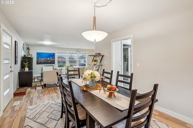 dining room featuring light hardwood / wood-style flooring