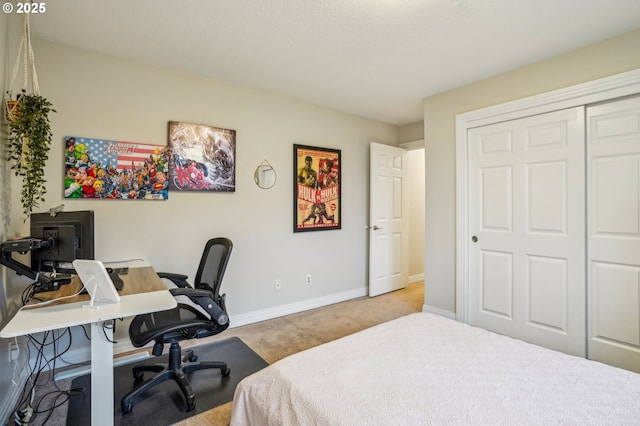 bedroom featuring light carpet and a closet