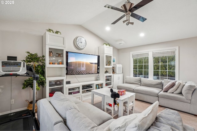 living room featuring a textured ceiling, lofted ceiling, and ceiling fan