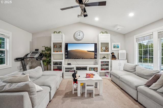 living area featuring light carpet, ceiling fan, vaulted ceiling, and recessed lighting