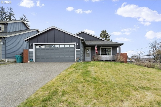 view of front of house with covered porch, a front lawn, a garage, aphalt driveway, and board and batten siding