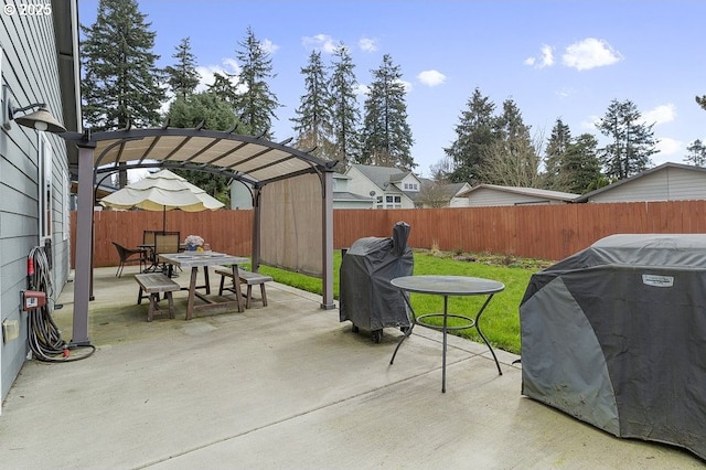 view of patio with outdoor dining space, a grill, a pergola, and a fenced backyard