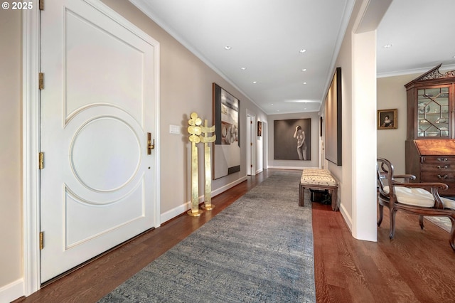 hallway with ornamental molding and dark hardwood / wood-style floors