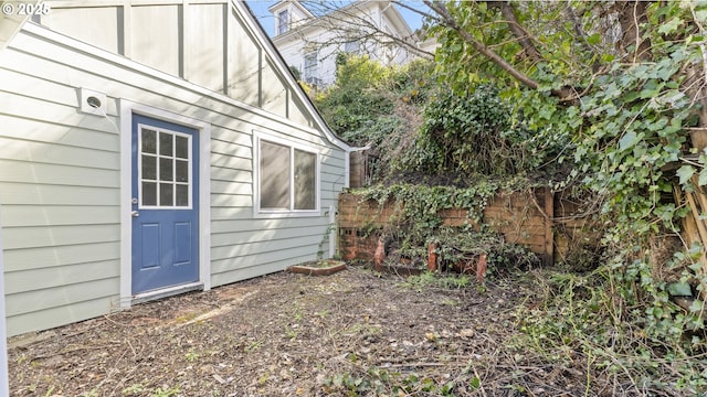 view of home's exterior featuring fence