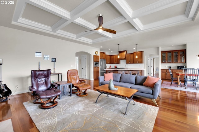 323 Argon Ave, Eugene, OR 97404 - living area featuring arched walkways, light wood finished floors, beam ceiling, coffered ceiling, and ceiling fan