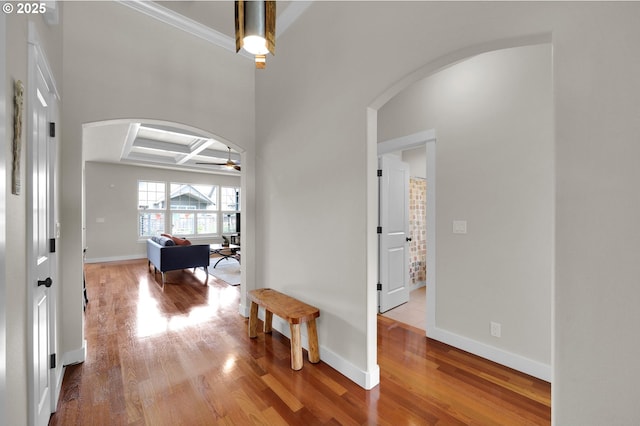 323 Argon Ave, Eugene, OR 97404 - hallway with arched walkways, wood finished floors, coffered ceiling, and crown molding