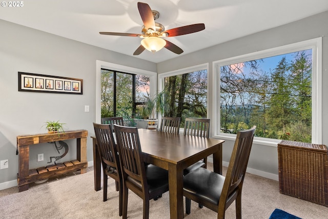 48 Eagle Crest Dr Unit 2E, Lake Oswego, OR 97035 - dining room featuring a ceiling fan, baseboards, and light colored carpet