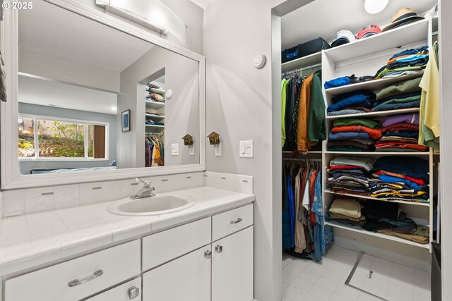 48 Eagle Crest Dr Unit 2E, Lake Oswego, OR 97035 - bathroom with a spacious closet and vanity