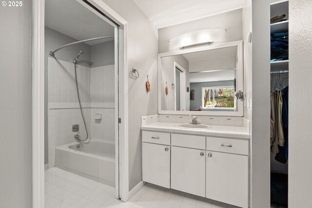 48 Eagle Crest Dr Unit 2E, Lake Oswego, OR 97035 - full bathroom with a walk in closet, vanity, and shower / bathing tub combination