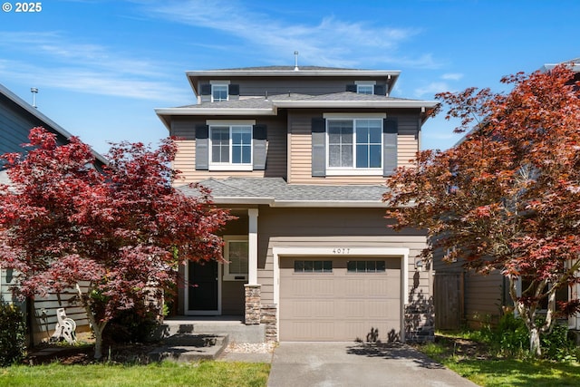 4077 SE Lone Oak St, Hillsboro, OR 97123 - view of front of home with an attached garage, concrete driveway, roof with shingles, and stone siding