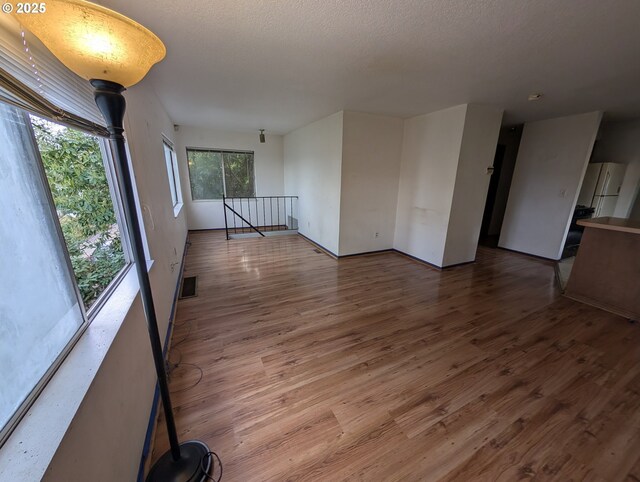 10539 NW 3rd St, Portland, OR 97231 - unfurnished room featuring wood finished floors and baseboards