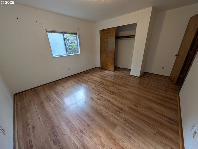 10539 NW 3rd St, Portland, OR 97231 - unfurnished bedroom featuring light wood-style floors and a closet
