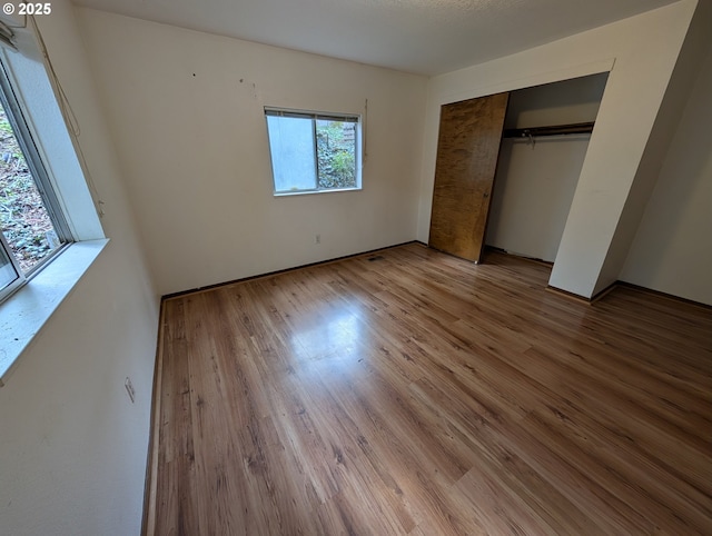 10539 NW 3rd St, Portland, OR 97231 - unfurnished bedroom featuring wood finished floors and a closet