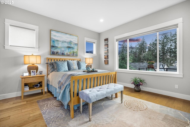 bedroom featuring recessed lighting, light wood-type flooring, and baseboards