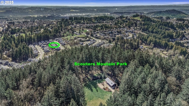 bird's eye view with a forest view