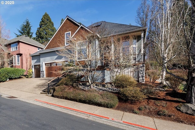 view of front of property with driveway and an attached garage