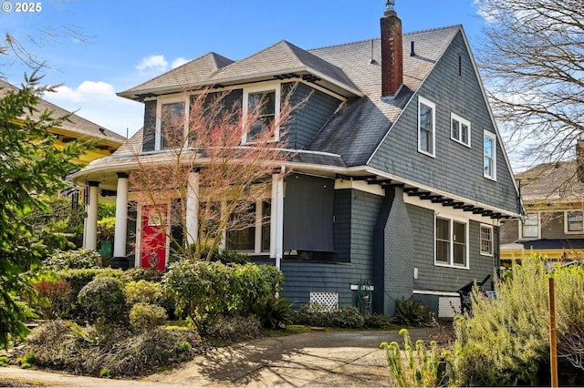 shingle-style home with a chimney