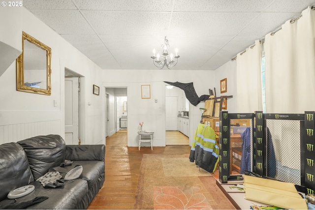307 Columbia St, Kelso, WA 98626 - living area featuring wood finished floors and a chandelier