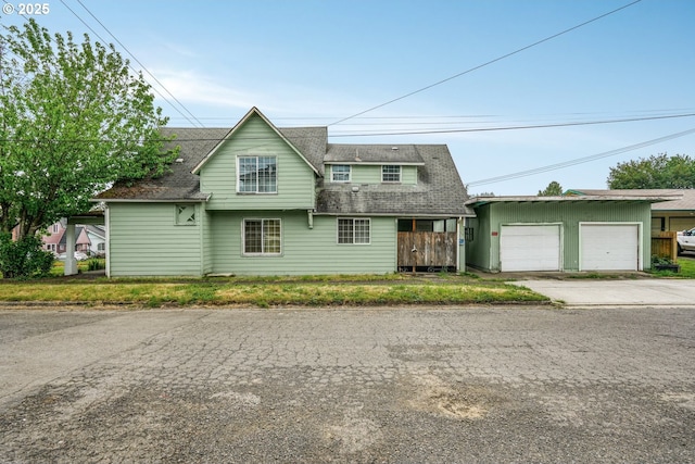 307 Columbia St, Kelso, WA 98626 - view of front of property with a garage and a shingled roof