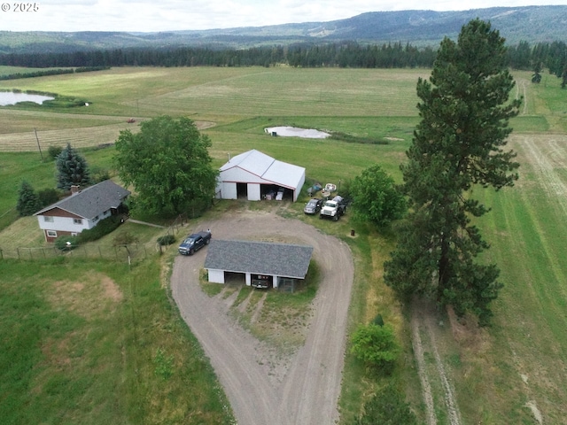 birds eye view of property with a rural view and a water and mountain view